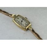 Ladies' Rolex wristwatch, oblong shaped dial with Arabic numerals, 9ct yellow gold case, back of