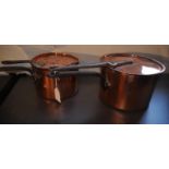 Two Victorian copper saucepans with covers
