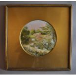 An Edwardian silkwork picture embroidered with a garden scene, 15cm diameter; one similar 13x10cm;