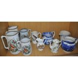 A collection of ten assorted jugs including a set of four Edwardian graduated jugs printed with