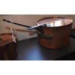A very large Victorian copper saucepan and cover
