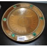 An engraved brass pedestal bowl set with six malachite stones
