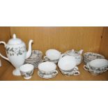 A part Wedgwood strawberry pattern service comprising a teapot, a coffee pot, eight soup bowls, a