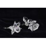 Two Swarovski crystal figures of flowers in their original boxes with certificates