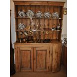 A 19th Century waxed pine dresser, the two tier plate rack above twin door base, 150cm w x 50d x