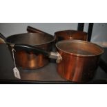 Three assorted copper Victorian saucepans