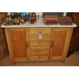 A Victorian pine marble topped sideboard, four drawers flanked by twin doors, 112w x 64d x 80h