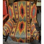 A Victorian armchair upholstered in patterned linen