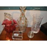 A vintage painted glass decanter and four other items of glass ware
