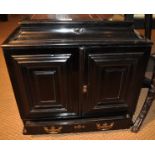 A Victorian ebonised work cabinet, the twin doors enclosing ten further drawers and central