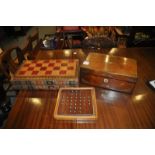 A mahogany writing slope with mother of pearl inlay, boxed games compendium and Chinese Chequers