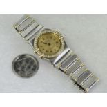 Ladies Omega Constellation wristwatch, gilt dial with diamond set bezel, steel and gold case and