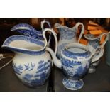 A collection of three Victorian blue and white wash jugs, a smaller jug and teapot