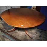 A Victorian mahogany tilt top oval dining table on tripod support with reeded legs, 148 x 116cm