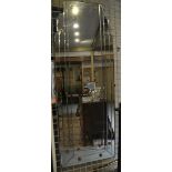 A shaped wall hanging robing mirror, 114cm high