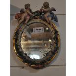 A Meissen putti decorated small oblong mirror