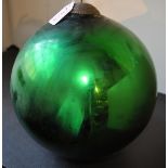 A Victorian green and red glass witches ball