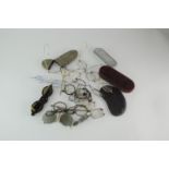 A collection of early monocles and spectacles, a shagreen case and other items