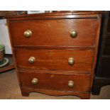 A Georgian oak chest of three drawers on bracket feet with brass knob handles.  The chest of small