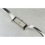 *Ladies' Gucci bangle watch, silvered rectangular dial, stainless steel case and bangle, 1500L