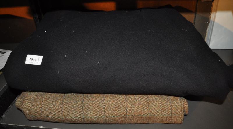 A quantity of Harris tweed type material and a quantity of black wool material
