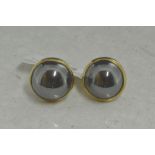 Single stone hematite ear studs set in yellow metal tested as 9ct