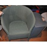A green Lloyd Loom chair and blue linen basket