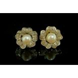 Pearl and diamond cluster earrings, central 6.4mm pearl in a floral diamond set surround, in white