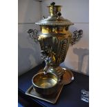 A late 19th Century Russian brass Samovar with bowl, tray and impressed makers mark