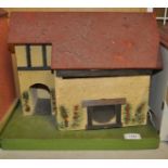 Two dolls houses - 'Rose Villa' and a scratch built rustic outbuilding together with a Tri-ang