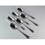 A collection of six George II Old English Pattern rat tailed table spoons and one Britannia standard
