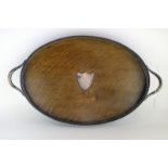An Edwardian oak and silver plated two-handled tray with pierced gallery, 60.5cm w