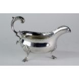 A George III silver sauce boat with c-handle on three hoof style feet, 219g