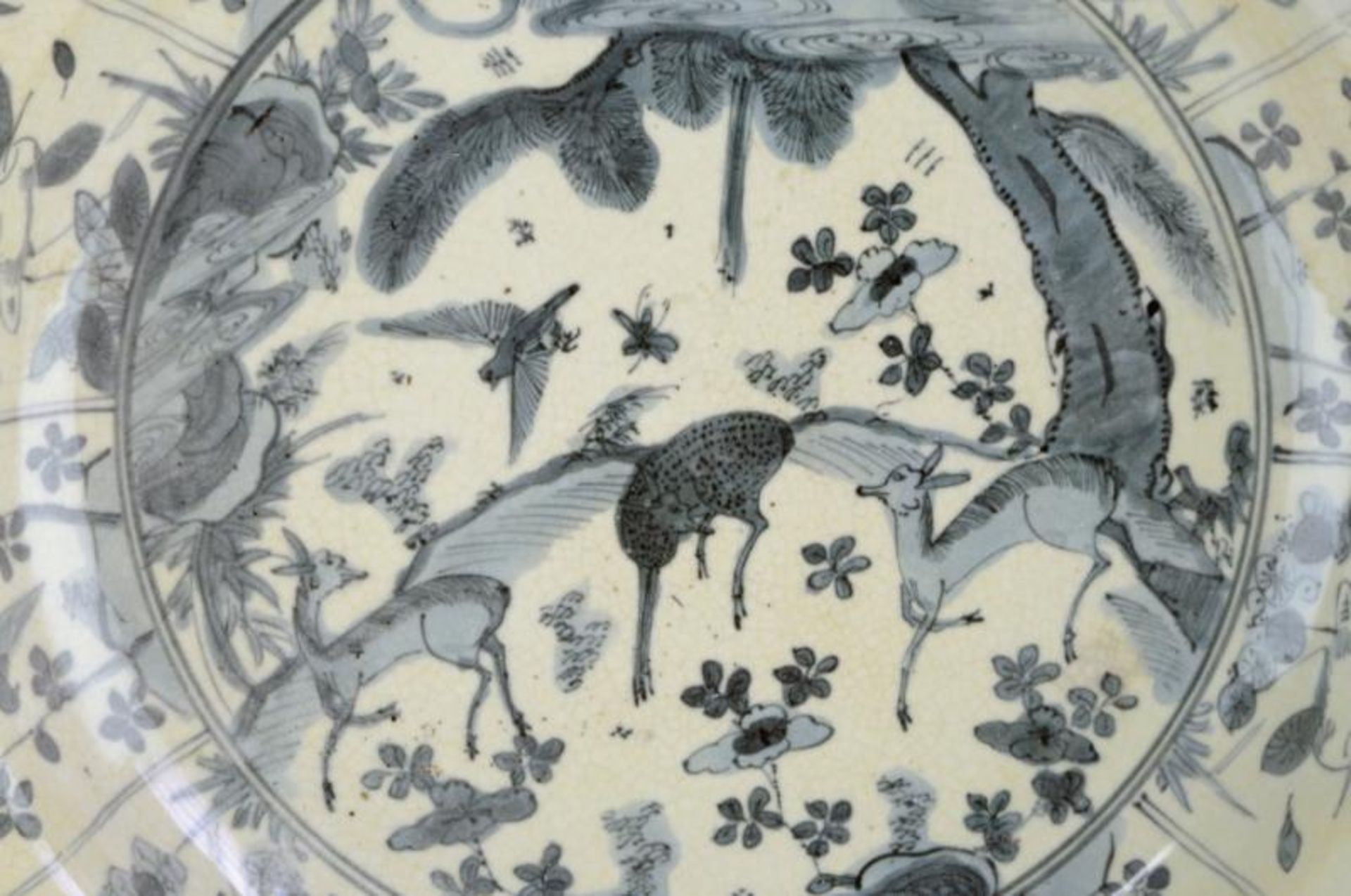 An Oriental Kraak style plate, probably provincial Chinese, painted in the centre with deer, the - Image 2 of 4