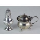 A silver baluster shaped pepperette with spirally fluted body, Birmingham 1900 and a silver