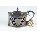 A silver mustard pot with blue liner (broken), Birmingham 1900, 63g and a gold watch key with the