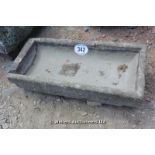 *A STONE TROUGH WITH A REPAIR AT ONE END, 900 X 400 X 160