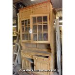 *A VICTORIAN PINE DRESSER COMPRISING GLAZED PLATE RACK ABOVE TWIN DOORS AND CUPBOARDS, 1260 X 300