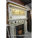 *AN ARTS AND CRAFTS/ART NOUVEAU FIRE SURROUND WITH LARGE GOLD PAINTED PANELS AND BRONZE PLAQUES,