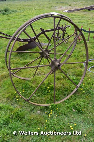 *A PAIR OF CAST IRON IMPLEMENT WHEELS, EACH 1250 DIAMETER