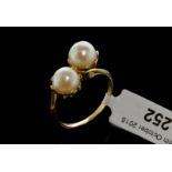 Double pearl twist ring, two white round pearls measure approximately 7mm in diameter, mounted in