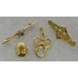 Selection of yellow metal jewellery, including 9ct yellow gold barrel charm, 9ct yellow gold