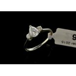 Single stone diamond ring, pear cut diamond, with two round brilliant cut diamonds set in shoulders,
