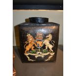 A toleware canister painted with the Royal coat of arms