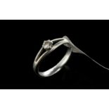 Single stone diamond ring, round brilliant cut diamond weighing an estimated 0.20ct, split