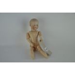 A Heubach 7602 bisque headed character doll, with domed head and moulded blonde hair, fixed blue