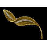 Diamond set leaf brooch, twisted leaf design with a central vein of Swiss cut diamonds, set in white