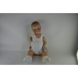 An Armand Marseille bisque headed 351 bisque headed baby doll with domed head, sleeping blue eyes,