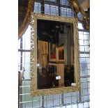 A rectangular pierced framed mirror, 44cm wide, 68cm high