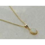 Single stone opal pendant, oval cabochon cut opal set in 9ct yellow gold on a 9ct yellow gold chain